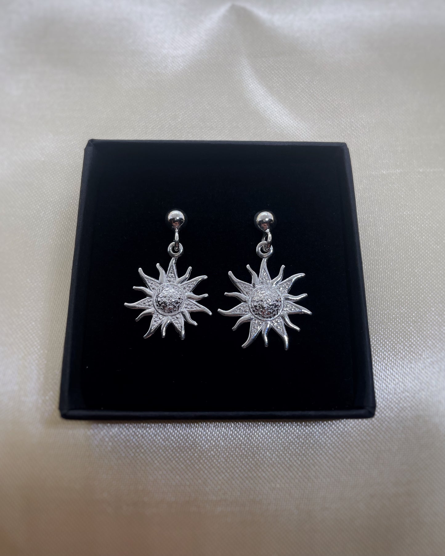 Sun studs earrings